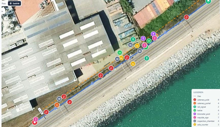 Satellite view with detected railway assets placed on the track alignment.
